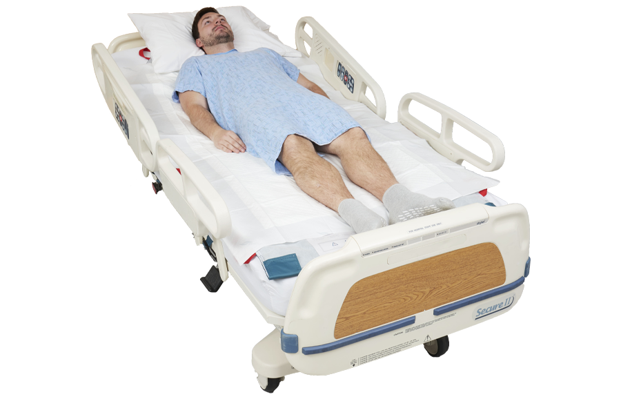 Patient lying in a hospital bed on top of a HoverMatt Single-Patient Use Air Mattress and disposable sheeet